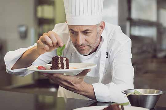 Chef Andre plating cake