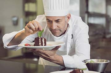 Chef Andre plating cake