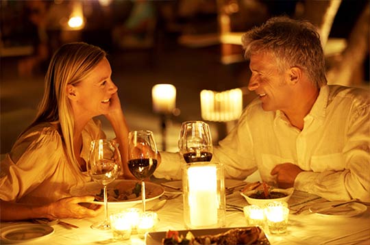 Couple enjoying dinner and wine